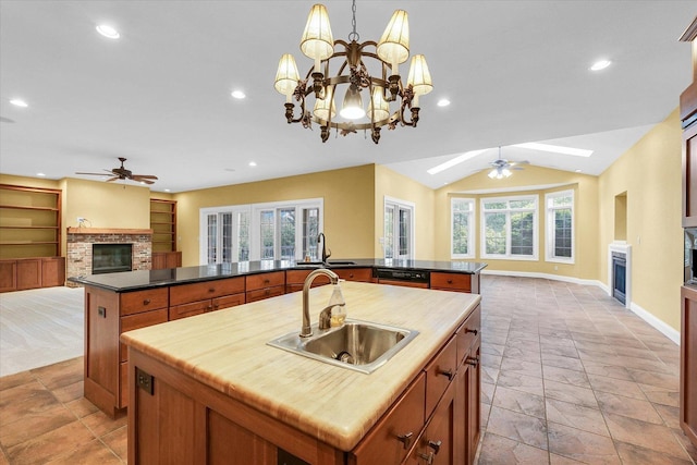 4410 Southford Trace Dr, Champaign, IL 61822 - kitchen with a brick fireplace, a spacious island, a ceiling fan, a sink, and open floor plan