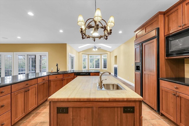 4410 Southford Trace Dr, Champaign, IL 61822 - kitchen with black appliances, a sink, a kitchen island with sink, brown cabinetry, and recessed lighting