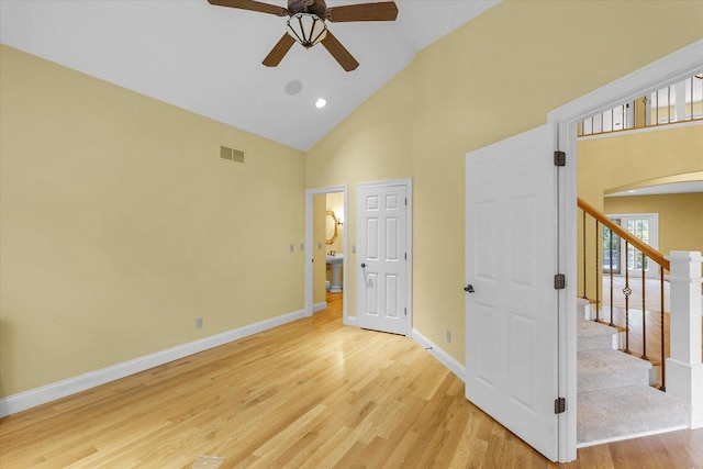 4410 Southford Trace Dr, Champaign, IL 61822 - unfurnished bedroom with high vaulted ceiling, light wood-style floors, arched walkways, baseboards, and ceiling fan