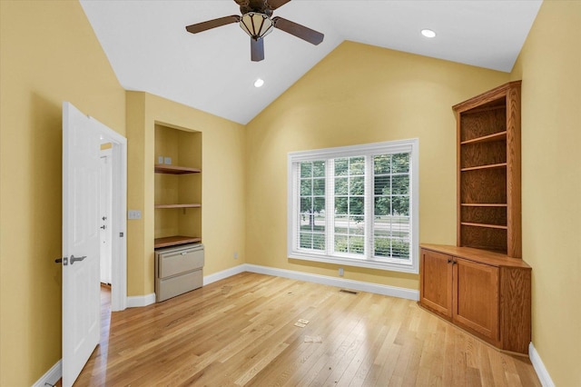 4410 Southford Trace Dr, Champaign, IL 61822 - unfurnished room with light wood-type flooring, ceiling fan, built in shelves, lofted ceiling, and baseboards
