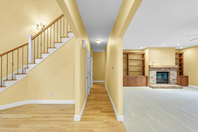 4410 Southford Trace Dr, Champaign, IL 61822 - corridor featuring baseboards, stairs, light wood finished floors, and built in shelves