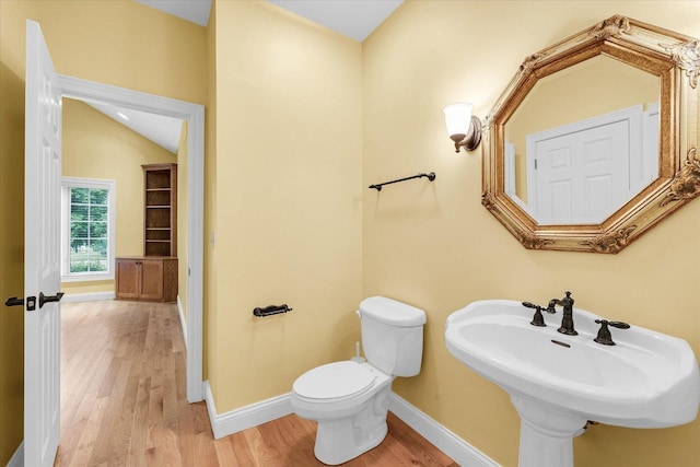 4410 Southford Trace Dr, Champaign, IL 61822 - bathroom with wood finished floors, toilet, baseboards, and a sink