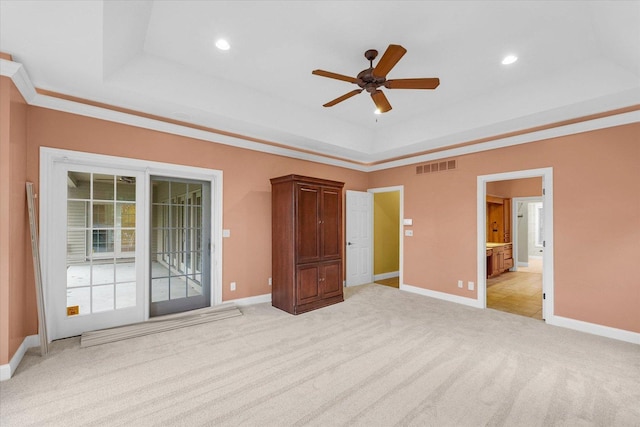 4410 Southford Trace Dr, Champaign, IL 61822 - unfurnished bedroom with a tray ceiling, light colored carpet, baseboards, recessed lighting, and ensuite bath