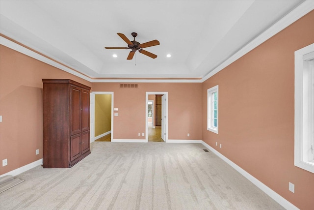 4410 Southford Trace Dr, Champaign, IL 61822 - unfurnished bedroom featuring a raised ceiling, recessed lighting, baseboards, light colored carpet, and a ceiling fan
