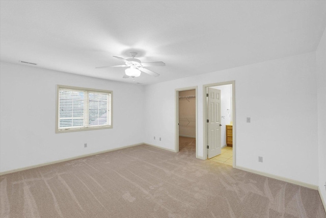 4410 Southford Trace Dr, Champaign, IL 61822 - spare room featuring light colored carpet, a ceiling fan, and baseboards