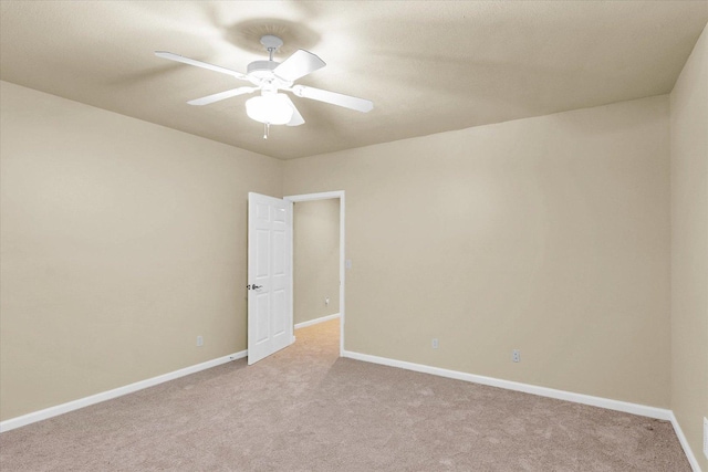 4410 Southford Trace Dr, Champaign, IL 61822 - unfurnished room with light carpet, ceiling fan, and baseboards
