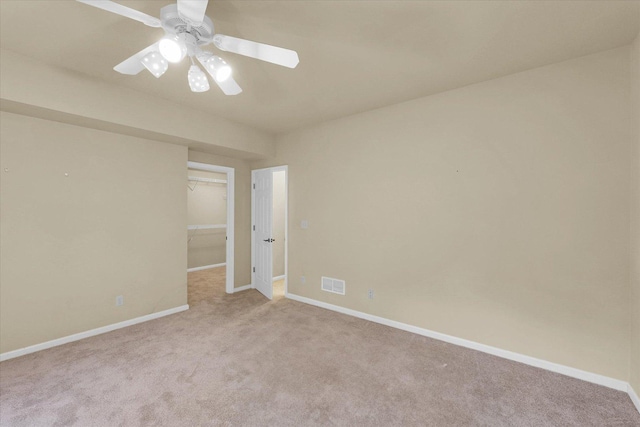 4410 Southford Trace Dr, Champaign, IL 61822 - carpeted empty room featuring baseboards and ceiling fan