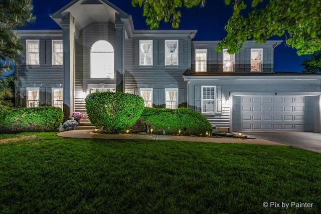 9 Laurel Valley Ct, Lake In The Hills, IL 60156 - view of front facade with a lawn, driveway, a garage, and stairway