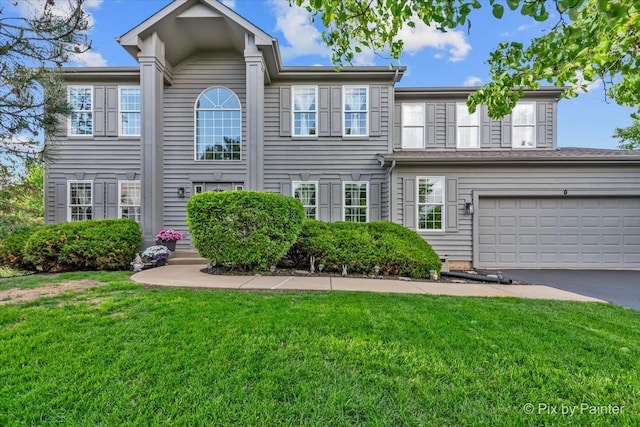 9 Laurel Valley Ct, Lake In The Hills, IL 60156 - view of front facade featuring a front lawn, asphalt driveway, and an attached garage
