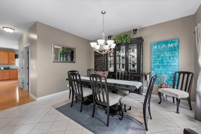 9 Laurel Valley Ct, Lake In The Hills, IL 60156 - dining area featuring a chandelier and light tile patterned floors