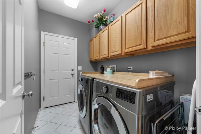 9 Laurel Valley Ct, Lake In The Hills, IL 60156 - laundry area featuring washing machine and clothes dryer, cabinet space, and light tile patterned flooring