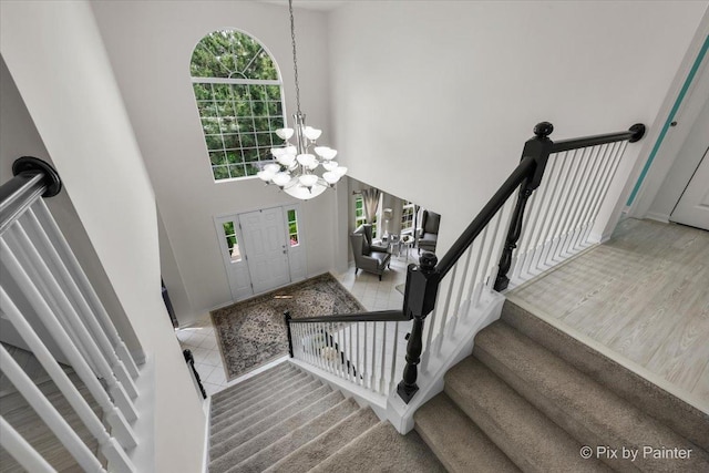 9 Laurel Valley Ct, Lake In The Hills, IL 60156 - foyer with a chandelier, a high ceiling, and stairs