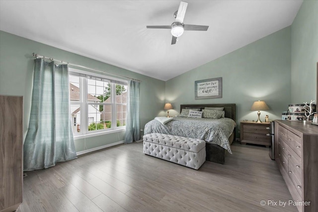 9 Laurel Valley Ct, Lake In The Hills, IL 60156 - bedroom with lofted ceiling, wood finished floors, and a ceiling fan