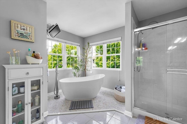 9 Laurel Valley Ct, Lake In The Hills, IL 60156 - full bath featuring a soaking tub, a shower stall, and tile patterned floors