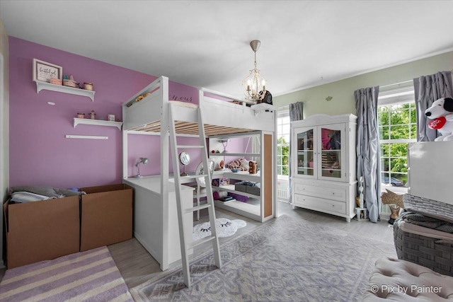 9 Laurel Valley Ct, Lake In The Hills, IL 60156 - bedroom with multiple windows, wood finished floors, and a chandelier