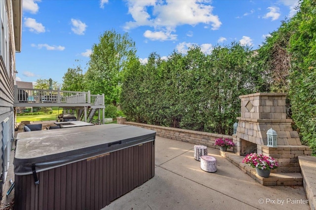 9 Laurel Valley Ct, Lake In The Hills, IL 60156 - view of patio / terrace with a hot tub, an outdoor stone fireplace, a deck, and stairway