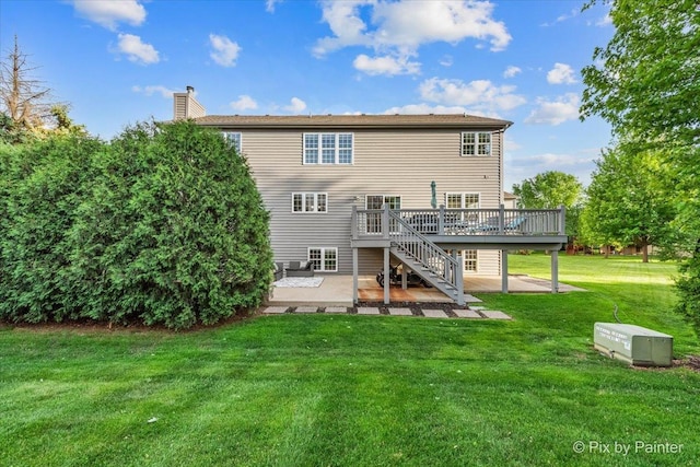 9 Laurel Valley Ct, Lake In The Hills, IL 60156 - rear view of property featuring a patio area, a wooden deck, stairs, a lawn, and a chimney