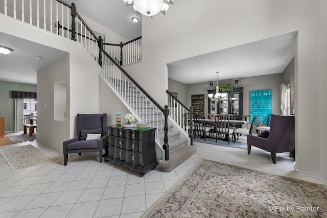 9 Laurel Valley Ct, Lake In The Hills, IL 60156 - stairs with a chandelier, tile patterned flooring, and a towering ceiling