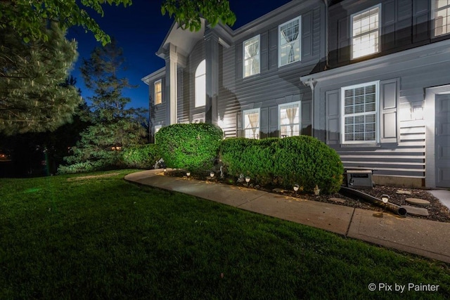 9 Laurel Valley Ct, Lake In The Hills, IL 60156 - property exterior at night featuring a yard