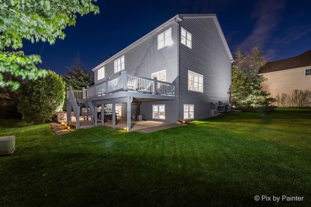 9 Laurel Valley Ct, Lake In The Hills, IL 60156 - back of house at night featuring a yard, a wooden deck, a patio area, and stairway