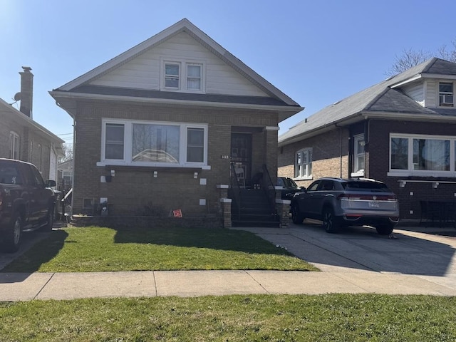 1118 N 6th Ave, Maywood, IL 60153 - bungalow featuring a front lawn and brick siding