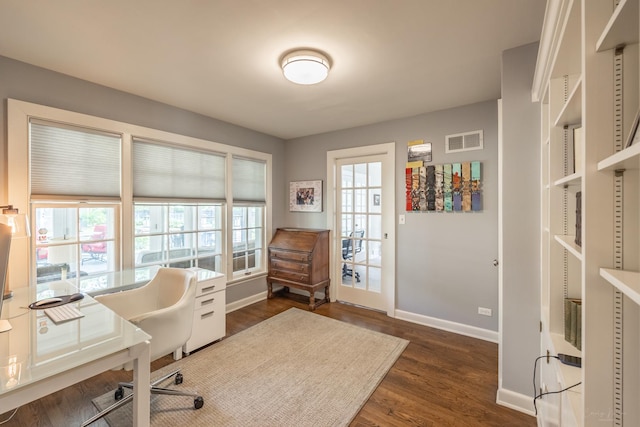 office space featuring baseboards and dark wood-type flooring