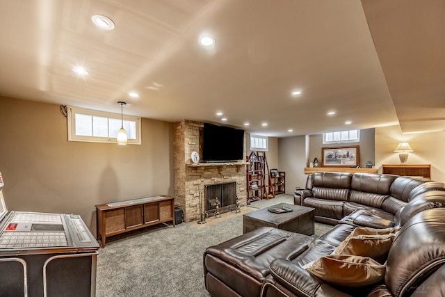 living room featuring recessed lighting, carpet, a fireplace, and healthy amount of natural light