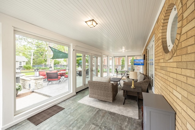sunroom featuring french doors