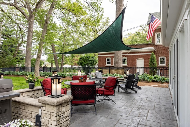 view of patio with outdoor dining space and a fenced backyard
