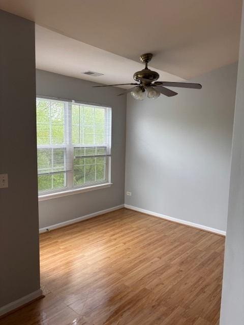 1286 N Red Oak Cir Unit 4, Round Lake Beach, IL 60073 - unfurnished room with baseboards, wood finished floors, and ceiling fan