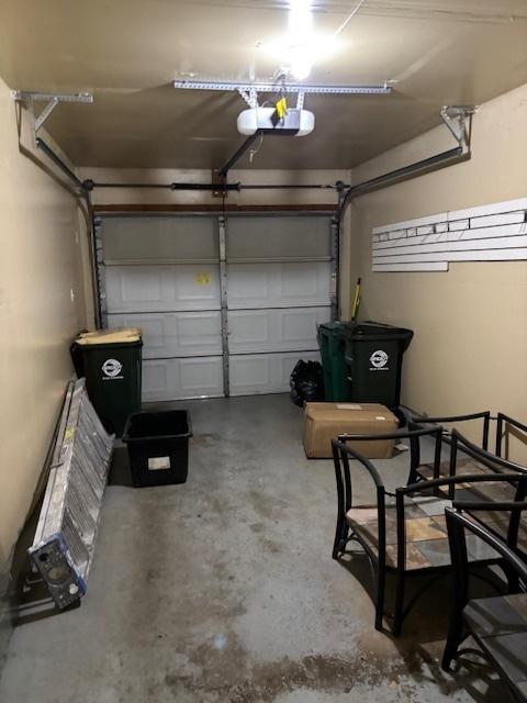 1286 N Red Oak Cir Unit 4, Round Lake Beach, IL 60073 - garage featuring a garage door opener