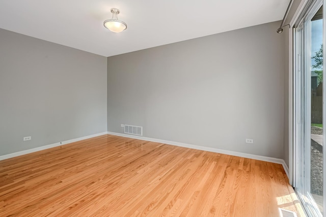 1400 Carleton Ave, Naperville, IL 60565 - empty room with wood finished floors and baseboards