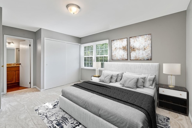 1400 Carleton Ave, Naperville, IL 60565 - carpeted bedroom featuring a closet, baseboards, and ensuite bathroom