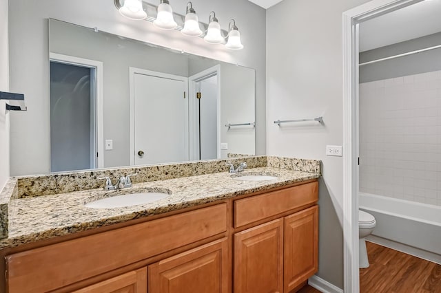 1400 Carleton Ave, Naperville, IL 60565 - full bathroom featuring wood finished floors, toilet, double vanity, and bathtub / shower combination