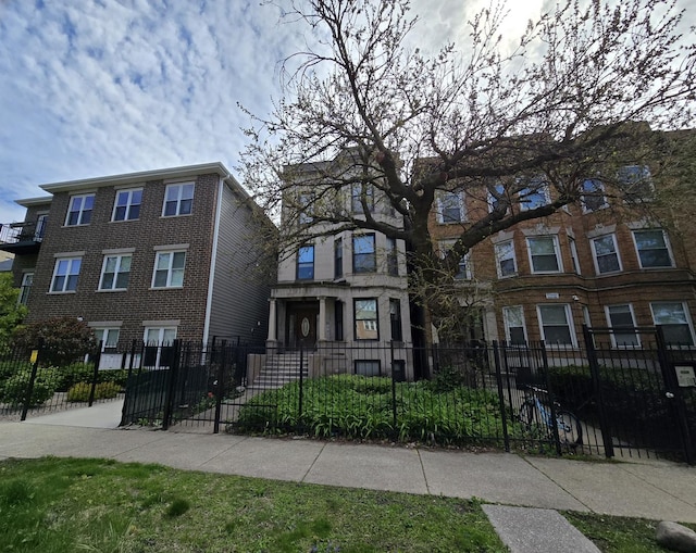 6137 S Kimbark Ave Unit 1, Chicago, IL 60637 - townhome / multi-family property with a fenced front yard