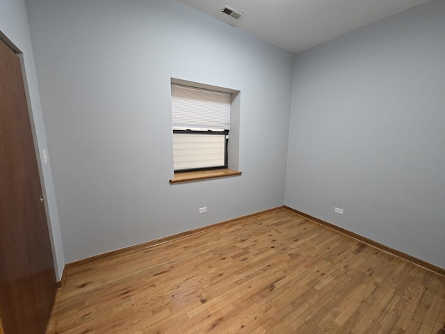 6137 S Kimbark Ave Unit 1, Chicago, IL 60637 - empty room with wood finished floors and baseboards
