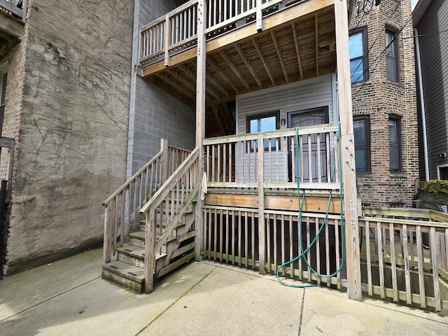 6137 S Kimbark Ave Unit 1, Chicago, IL 60637 - doorway to property featuring a wooden deck and brick siding