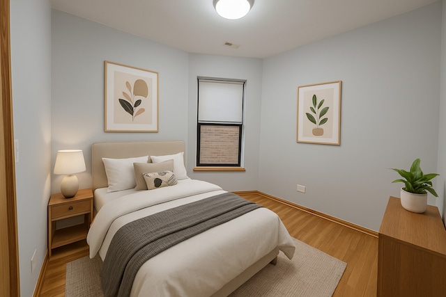 6137 S Kimbark Ave Unit 1, Chicago, IL 60637 - bedroom with light wood-type flooring and baseboards