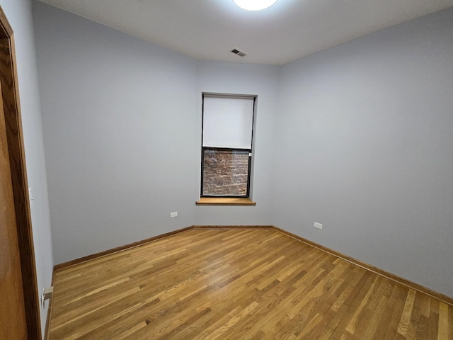 6137 S Kimbark Ave Unit 1, Chicago, IL 60637 - empty room featuring light wood finished floors and baseboards