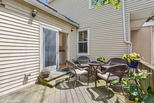 1022 Elmwood Ave, Evanston, IL 60202 - wooden deck featuring outdoor dining space