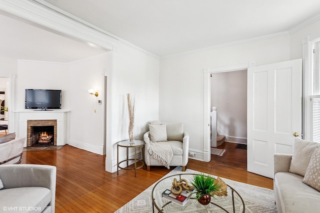 1022 Elmwood Ave, Evanston, IL 60202 - living room featuring wood finished floors, ornamental molding, a fireplace, and baseboards