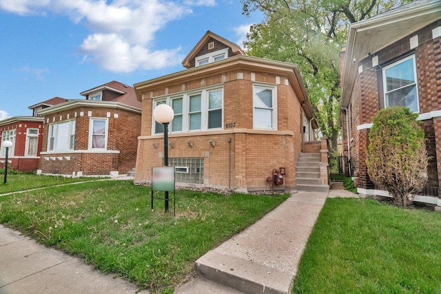 8107 S Princeton Ave, Chicago, IL 60620 - view of front of house with a front yard and brick siding
