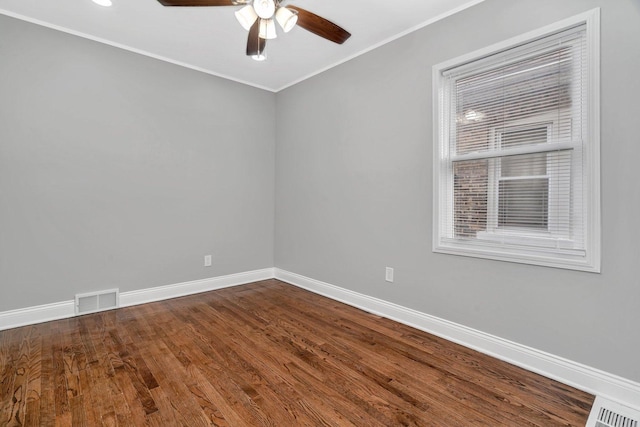 8107 S Princeton Ave, Chicago, IL 60620 - unfurnished room featuring baseboards, a ceiling fan, dark wood finished floors, and crown molding