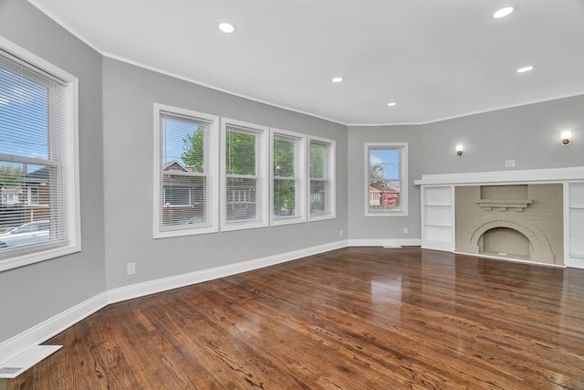 8107 S Princeton Ave, Chicago, IL 60620 - unfurnished living room with plenty of natural light, recessed lighting, crown molding, baseboards, and wood finished floors