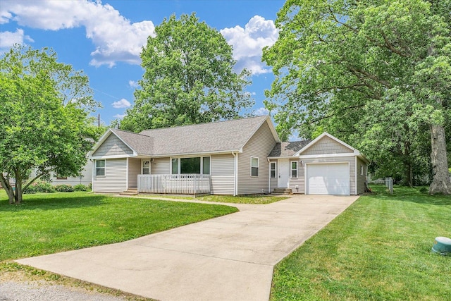 106 W Dunbar St, Mahomet, IL 61853 - view of front of home with an attached garage, a front yard, concrete driveway, and covered porch