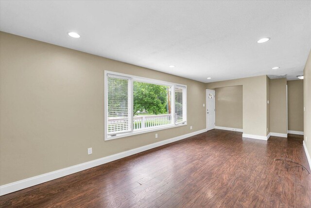 106 W Dunbar St, Mahomet, IL 61853 - unfurnished room featuring wood finished floors, baseboards, and recessed lighting