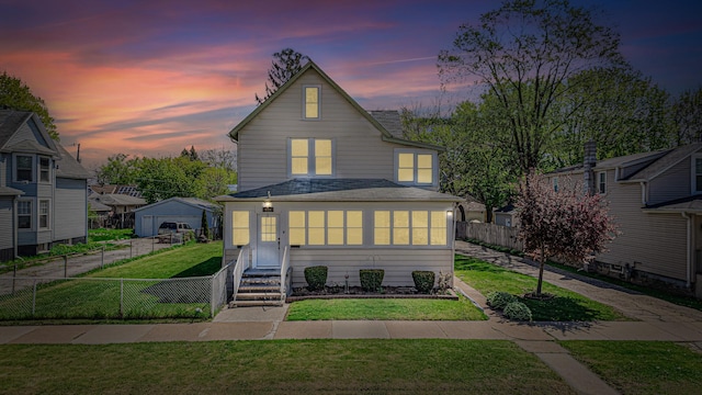 view of front of home featuring entry steps and a shingled roof