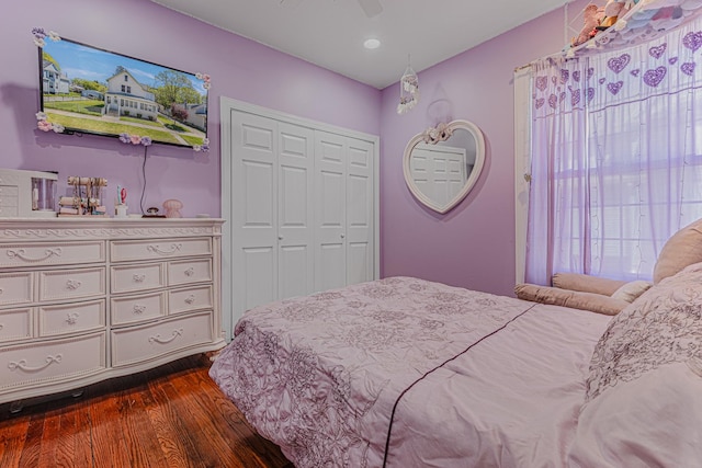 bedroom featuring dark wood finished floors, a closet, and a ceiling fan