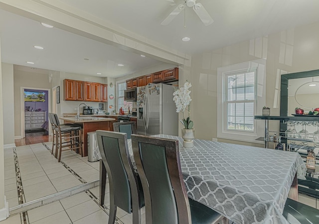 dining area with ceiling fan, light tile patterned floors, recessed lighting, and baseboards