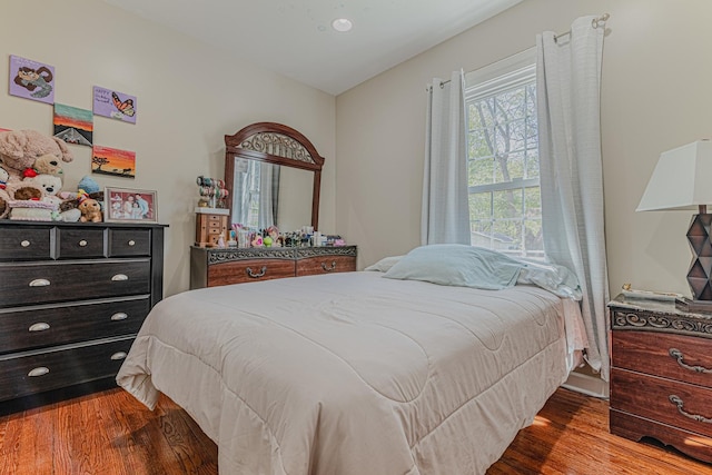 bedroom with wood finished floors